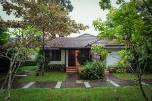 a house with a garden in front of it at Misty Grove Resort in Devāla