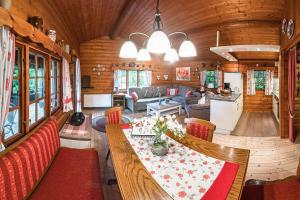 a dining room and living room in a train car at Schwedenhaus Uplandalm Willingen in Bömighausen