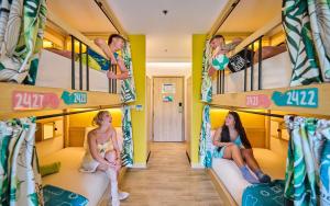 a group of people sitting on bunk beds at Lub d Koh Samui Chaweng Beach - Beachfront & Vibrant Social Vibe in Chaweng