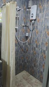 a shower in a bathroom with a shower curtain at Dream Paradise Apartment in Korotogo +17 photos