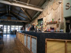 a bar in a restaurant with a counter at 88, Two bed Chalet on Belle Aire Holiday Park - sleeps 5, pet friendly, bed linen and towels included plus onsite entertainment available in Great Yarmouth +17 photos