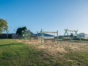 a row of playground equipment in a park at 88, Two bed Chalet on Belle Aire Holiday Park - sleeps 5, pet friendly, bed linen and towels included plus onsite entertainment available in Great Yarmouth