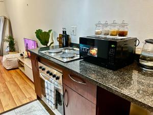 a kitchen with a microwave on top of a counter at High Rise Haven 2 in Johannesburg