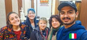 a group of people posing for a picture at Hotel Anjana Cottage - Stay 5 min Away From Golden Temple in Amritsar +44 photos