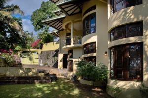an exterior view of a house at Whispering Trees in Kandy