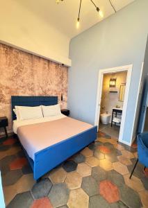a bedroom with a large bed in a room at Dimora San Lorenzo in Taranto