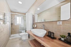 a bathroom with a sink and a toilet at Merced luxury in Málaga +31 photos