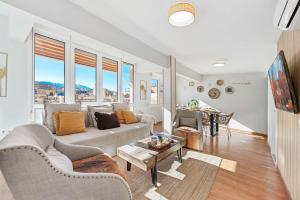 a living room with a couch and a table at Merced luxury in Málaga