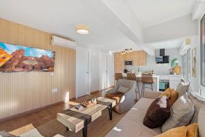 a living room with a couch and a table at Merced luxury in Málaga