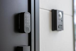 a close up of a door with a remote control at Seven Saunas Village in Arao