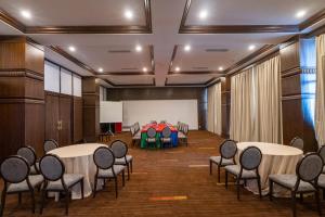 a conference room with tables and chairs in a room at Chandragiri Hills Resort Kathmandu-Luxury in the Clouds in Thānkot +123 photos