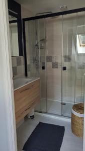 a bathroom with a shower and a sink and a tub at La Gitane in Saint-Valéry-sur-Somme +14 photos