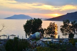 a view of a body of water at sunset at Villa Aristoteles in Halki