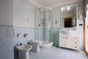 a bathroom with a toilet and a shower and a sink at Hotel La Fayette Giugliano Licola in Giugliano in Campania