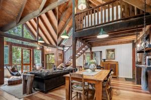 a living room with a table and a couch at Rustic 3-Bed Retreat in Springbrook in Springbrook