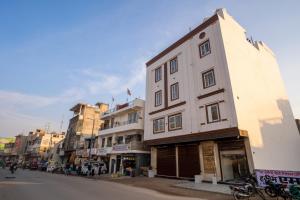 a building on the side of a city street at Hotel Delhi 53 Near ISBT Kashmiri Gate in Delhi