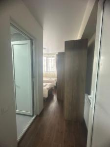 a room with a room with a bed and a window at Mini hotel falcon in Bakuriani