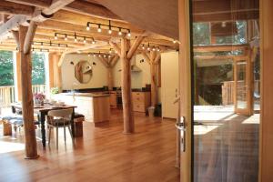 a large kitchen and dining room with a table and a dining room at Journeyman in Bromyard