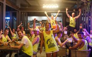 a group of people in yellow shirts posing for a picture at Lub d Koh Samui Chaweng Beach - Beachfront & Vibrant Social Vibe in Chaweng +53 photos