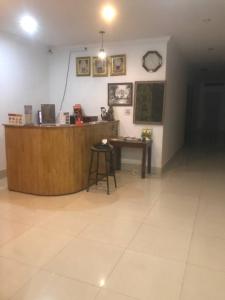 a room with a counter and a desk in a room at Siem Reap ABACUS Hotel in Siem Reap +35 photos
