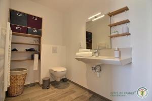 a bathroom with a sink and a toilet at Ker illis in Lannion +24 photos