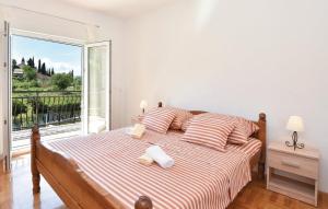 a bedroom with a bed and a large window at Villa Cascata in Trilj +17 photos