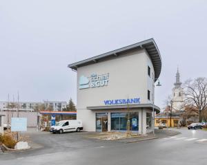 a white building with a volkspark sign on it at Das schlaf&GUT - Self Check-In in Leibnitz +38 photos
