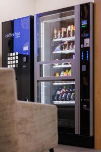 an open refrigerator with food inside of it at Das schlaf&GUT - Self Check-In in Leibnitz