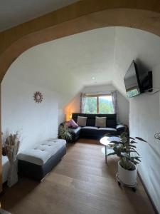 a living room with a couch and a table at Ferienhaus Julia in Admont