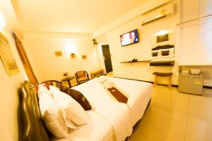 TV a/nebo společenská místnost v ubytování TH beach hotel
