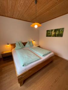 a bedroom with a large bed in a room at Ferienhaus Julia in Admont