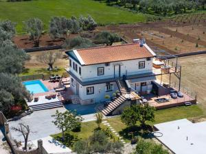 an aerial view of a house with a swimming pool at Villa Sorina Kefalonia in Svoronata