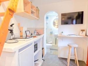 a bathroom with a sink and a toilet and a counter at Le Balinais - Esprit Bali, Centre-ville & Unique in Saint-Brieuc +9 photos