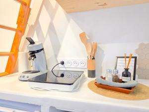 a kitchen counter with a mixer on a counter top at Le Balinais - Esprit Bali, Centre-ville & Unique in Saint-Brieuc