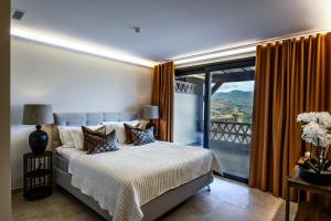 a bedroom with a bed and a large window at Palacio de Cantalobos in Almuñécar +154 photos