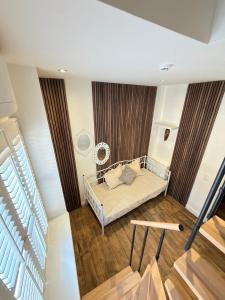 a bedroom with a bed in a room at La Luna Guesthouse in Bruges