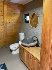 a bathroom with a sink and a toilet at Harmony Cottage - Private Jacuzzi & Nature in Banja Luka