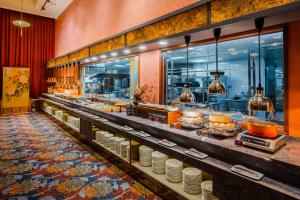 a buffet line of food in a restaurant at CHECK inn Select Tainan Yongkang in Yongkang
