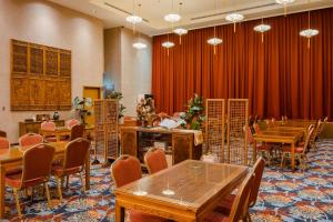a conference room with wooden tables and chairs at CHECK inn Select Tainan Yongkang in Yongkang