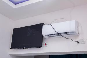 a white printer sitting on top of a desk at Salama Blue Lodge in Lusaka