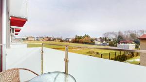 a balcony with a view of a field at Apartament Fibra Bounty in Rybnik