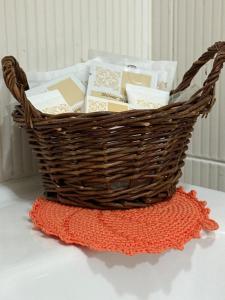 a basket filled with books sitting on a table at Casa nella Corte in Bellano