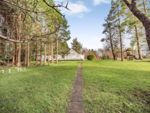 a path in a field with a house in the background at 2 Bed in Dunkineely oc-ii05062 in Dunkineely