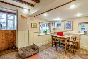 a home office with a desk and a laptop at 4 Bed in Walberswick oc-hfarm2 in Walberswick