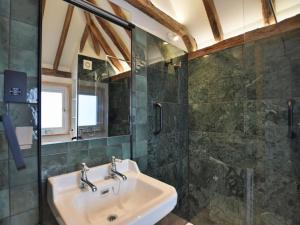 a bathroom with a sink and a shower at 1 Bed in Ashford oc-bt064 in Biddenden