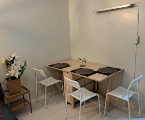 a small room with a table and chairs at Sandstone Unit Brenthill Condo in Baguio