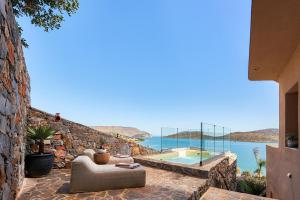 a villa with a view of the ocean at Enorme Infinity Elounda - Adults Only in Elounda