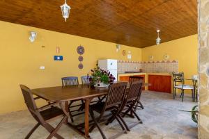 a dining room with a wooden table and chairs at Martina B&B in Agropoli +17 photos