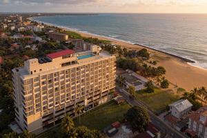 an aerial view of a hotel and the beach at Corundum Breeze Negombo in Negombo