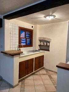 a kitchen with a sink and a window at Ca' Del Doge in Caorle